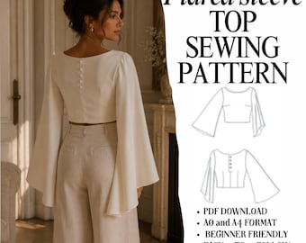 Könnte beinhalten: Ein weißes Oberteil mit langen, ausgestellten Ärmeln und Knopfleiste am Rücken, kombiniert mit einer hellen Hose. Das Bild enthält den Text: Flared sleeve TOP SEWING PATTERN, PDF DOWNLOAD, A0 and A4 FORMAT, BEGINNER FRIENDLY, EASY TO FOLLOW INSTRUCTIONS.