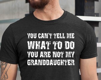 May include: A dark gray t-shirt with the text "You can't tell me what to do you are not my granddaughter" printed in white.
