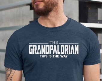 May include: A navy blue t-shirt with white text that reads "The Grandpalorian This is the Way".