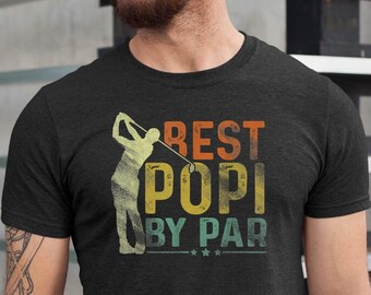 May include: A dark gray t-shirt with a vintage-style graphic of a golfer and the text "Best Popi By Par".