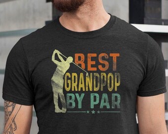 May include: A dark heather grey t-shirt with a vintage-style graphic of a golfer and the text "BEST GRANDPOP BY PAR".
