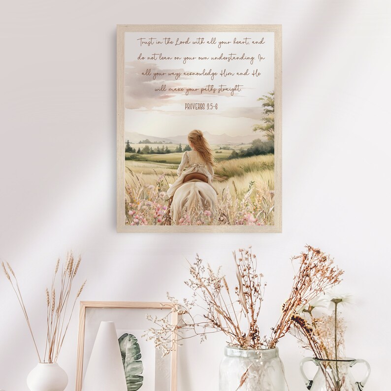 May include: A framed watercolor print featuring a girl riding a white horse through a field of wildflowers. The artwork has a soft, pastel color palette and includes the text "Trust in the Lord with all your heart... Proverbs 3:5-6."