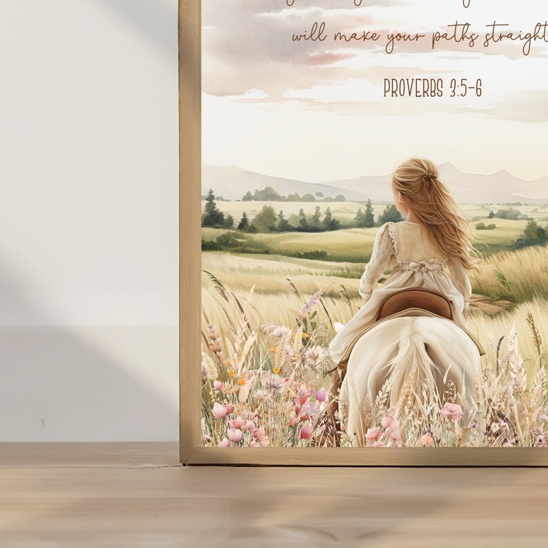 May include: A framed watercolor print depicts a young person riding a white horse through a field of tall grass and wildflowers. The artwork has a soft, pastel color palette with text from Proverbs 3:5-6.