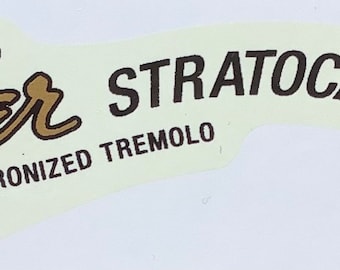 Custom gold decal for guitar headstock.