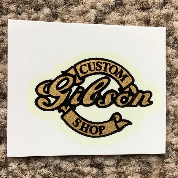 Custom gold decal for guitar headstock.