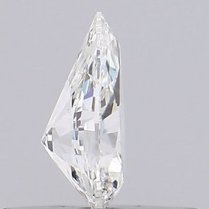 May include: A clear, faceted diamond with a brilliant cut. The diamond is set in a ring setting, with a metal band visible at the bottom of the image.