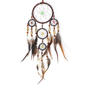 May include: A brown dreamcatcher with feathers and beads. The dreamcatcher has four circles, with the largest circle at the top and the smallest circle at the bottom. The dreamcatcher is decorated with brown beads and feathers.