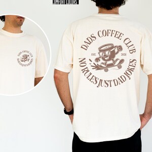 Celebrate the joy of fatherhood with this cozy Comfort Colors shirt, designed especially for new dads and coffee lovers alike. Inspired by the warmth of family moments, this tee perfectly blends style and comfort, making it an ideal Fathers Day gift or a thoughtful addition to any dad's wardrobe. Whether he's enjoying a quiet coffee break or cheering at the ballpark, this dads coffee club shirt honors those special connections.