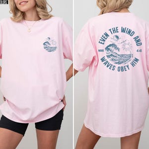 Experience the serene power of faith with our Comfort Colors shirt, inspired by the scripture from Mark 4:41. This waves obey him shirt beautifully captures a moment of divine calm, perfect for those who cherish ocean inspired style and seek a meaningful church service shirt. Crafted for comfort and spiritual connection, it’s an ideal choice for beach Christian gatherings or everyday wear.