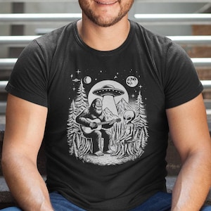 Bigfoot Play Guitar with Alien and UFO shirt, Bigfoot and alien shirt gift for outdoor lover, Woodland tshirt, Camping Tshirt, Sasquatch Tee