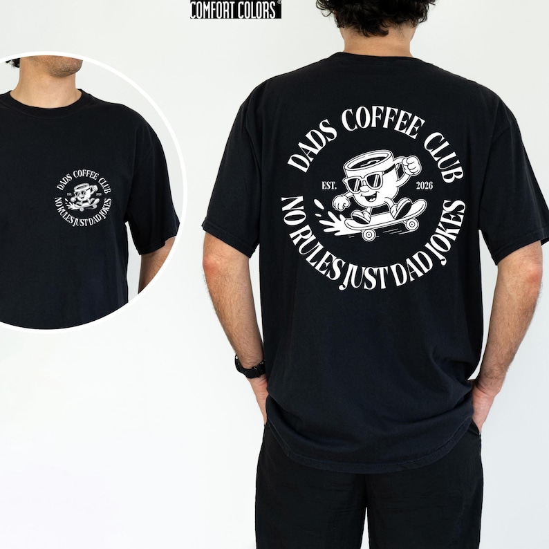 a man wearing a black t-shirt with a graphic design on the back.