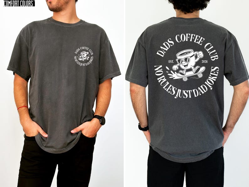a man wearing a grey t-shirt with a graphic design on the back.