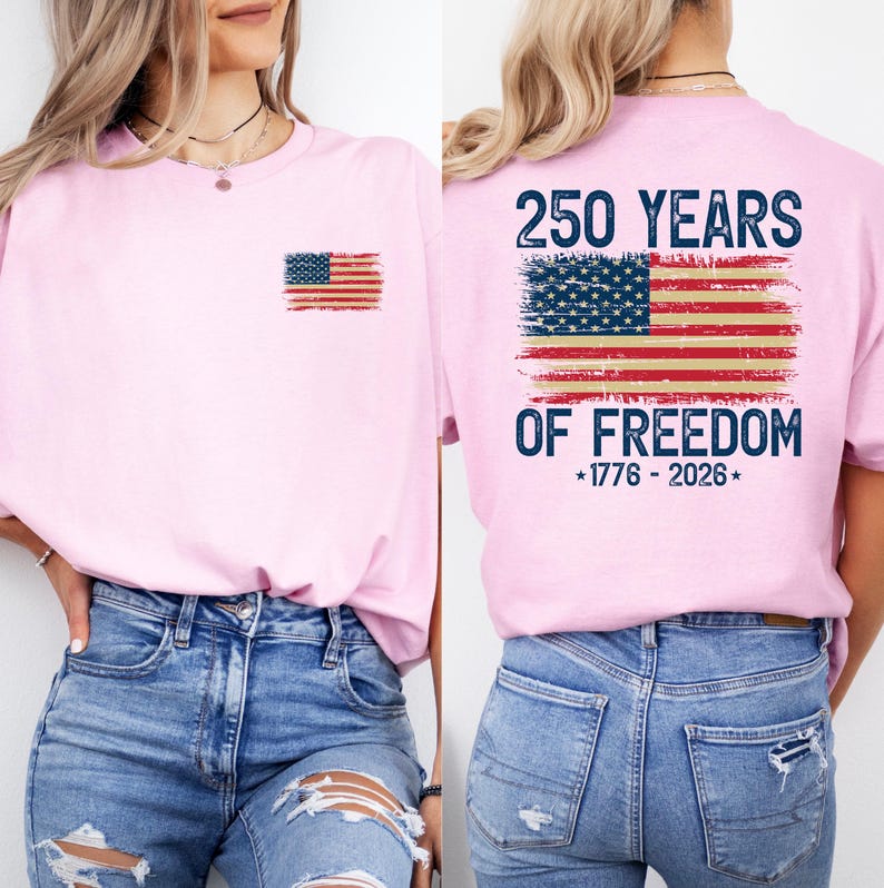A woman wearing a pink t-shirt with an American flag design and text printed on the back.