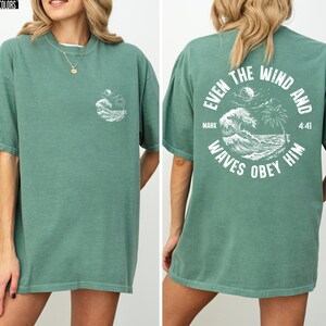Experience the serene power of faith with our Comfort Colors shirt, inspired by the scripture from Mark 4:41. This waves obey him shirt beautifully captures a moment of divine calm, perfect for those who cherish ocean inspired style and seek a meaningful church service shirt. Crafted for comfort and spiritual connection, it’s an ideal choice for beach Christian gatherings or everyday wear.