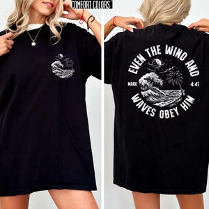 Experience the serene power of faith with our Comfort Colors shirt, inspired by the scripture from Mark 4:41. This waves obey him shirt beautifully captures a moment of divine calm, perfect for those who cherish ocean inspired style and seek a meaningful church service shirt. Crafted for comfort and spiritual connection, it’s an ideal choice for beach Christian gatherings or everyday wear.