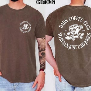 Celebrate the joy of fatherhood with this cozy Comfort Colors shirt, designed especially for new dads and coffee lovers alike. Inspired by the warmth of family moments, this tee perfectly blends style and comfort, making it an ideal Fathers Day gift or a thoughtful addition to any dad's wardrobe. Whether he's enjoying a quiet coffee break or cheering at the ballpark, this dads coffee club shirt honors those special connections.