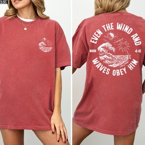 Experience the serene power of faith with our Comfort Colors shirt, inspired by the scripture from Mark 4:41. This waves obey him shirt beautifully captures a moment of divine calm, perfect for those who cherish ocean inspired style and seek a meaningful church service shirt. Crafted for comfort and spiritual connection, it’s an ideal choice for beach Christian gatherings or everyday wear.