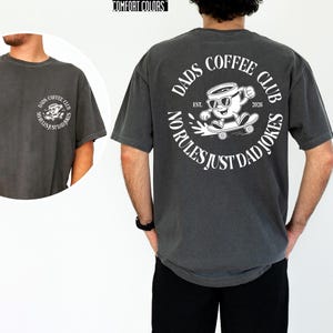 Celebrate the joy of fatherhood with this cozy Comfort Colors shirt, designed especially for new dads and coffee lovers alike. Inspired by the warmth of family moments, this tee perfectly blends style and comfort, making it an ideal Fathers Day gift or a thoughtful addition to any dad's wardrobe. Whether he's enjoying a quiet coffee break or cheering at the ballpark, this dads coffee club shirt honors those special connections.