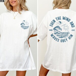 Experience the serene power of faith with our Comfort Colors shirt, inspired by the scripture from Mark 4:41. This waves obey him shirt beautifully captures a moment of divine calm, perfect for those who cherish ocean inspired style and seek a meaningful church service shirt. Crafted for comfort and spiritual connection, it’s an ideal choice for beach Christian gatherings or everyday wear.