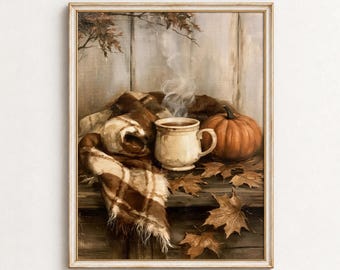 May include: A framed oil painting depicting a steaming ceramic mug, a vibrant orange pumpkin, and a brown plaid blanket resting on a wooden surface. Scattered dried maple leaves surround the objects against a rustic, light-colored wooden wall.