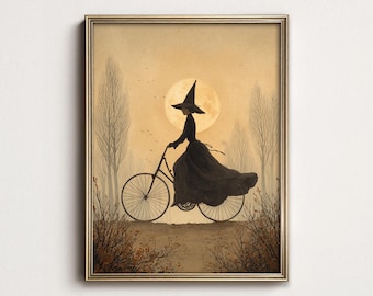May include: A framed wall art print depicting a silhouette of a figure wearing a pointed hat and a long flowing dress riding a bicycle. The scene is set against a large, pale full moon in a sepia-toned landscape with bare trees and dry bushes.