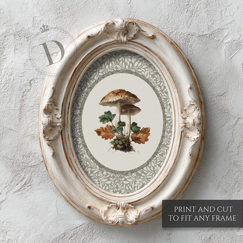 May include: An oval, distressed white picture frame with a botanical print featuring two mushrooms, green leaves, and brown leaves. The print is surrounded by a gray and white floral pattern. The text "PRINT AND CUT TO FIT ANY FRAME" is at the bottom.