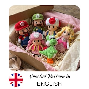 May include: A collection of handmade crochet figures of popular video game characters, including Mario, Luigi, Toad, Princess Peach, Yoshi, and Toadette. The figures are in a cardboard box with tissue paper. The text "Crochet Pattern in ENGLISH" is at the bottom.