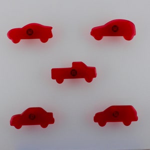 May include: Five red car-shaped objects with a circular design in the centre. The cars include a coupe, sedan, SUV, and pickup truck. The objects are arranged on a white background.