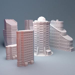Puede incluir: Colección de modelos de edificios en miniatura de color claro. Las estructuras varían en diseño, incluyendo una torre redondeada, un edificio escalonado y un rascacielos rectangular. Los modelos están sobre un fondo azul-gris apagado.