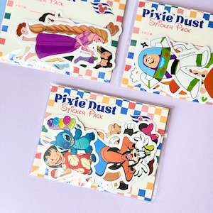 May include: A white ceramic mug with a black handle and the text "But First, Coffee" in a black, handwritten-style font. The mug is on a white surface.