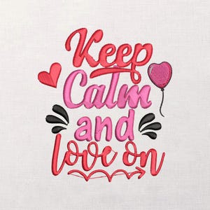 May include: Embroidered design with the words "Keep Calm and Love On" in red and pink. The design includes a heart-shaped balloon, a small heart, and decorative flourishes, all on a white fabric background.