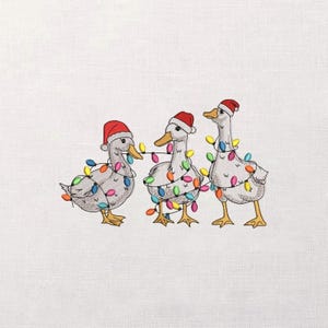May include: Embroidered image of three geese wearing Santa hats and wrapped in colorful Christmas lights. The geese have yellow beaks and feet, and are set against a white background. A festive holiday design.