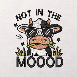 May include: Embroidered design featuring a black and white cow wearing sunglasses and chewing grass. The text "NOT IN THE MOOOOD" is above and below the cow illustration. The design includes stars and grass.