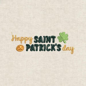 May include: Embroidered design with the text "Happy Saint Patrick's Day" in gold and dark green. A gold coin and a green shamrock are also included in the design. The design is on a light beige fabric.