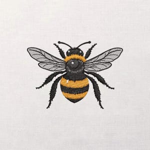 May include: Embroidered image of a bumblebee with black and yellow stripes. The bee has detailed wings and antennae, and is set against a white background. The design is likely for a patch or embroidery project.