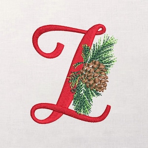 May include: Embroidered red letter "L" with a pinecone and evergreen sprigs. The design features a detailed stitch pattern, showcasing a festive, nature-inspired theme. The letter is a bold, decorative element, perfect for personalized crafts.