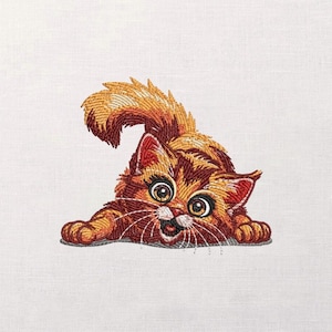 May include: Embroidered image of a playful orange and brown tabby cat with large, expressive eyes and a wide, happy grin. The cat is in a playful pose, paws outstretched, tail curved upwards. The embroidery is detailed and vibrant.