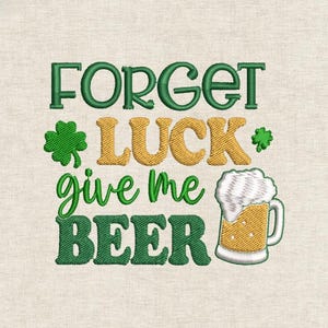 May include: Embroidered design with the text "FORGET LUCK give me BEER" in green and gold. Includes a shamrock and a beer mug with foam. The design is on a beige fabric.