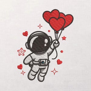 May include: Embroidered design of an astronaut floating with three red heart-shaped balloons. The astronaut is wearing a white spacesuit with a black helmet. Red hearts and stars are scattered around the astronaut on a white background.