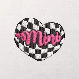May include: Embroidered heart-shaped patch with a black and white checkered pattern. The word "Mini" is embroidered in a bright pink, cursive font across the center of the heart. The patch is likely for clothing or accessories.