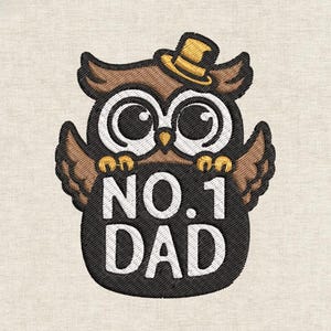 May include: Embroidered owl wearing a yellow top hat, holding a black sign with the text "NO. 1 DAD" in white. The owl has large, round eyes and brown and tan feathers. The background is a light beige fabric.
