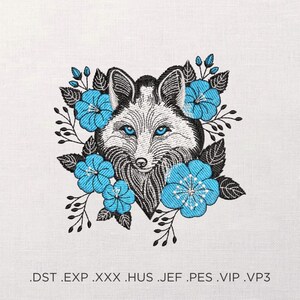 May include: Embroidered design of a fox's face with blue eyes, surrounded by blue flowers and black leaves. The fox has a white and black fur pattern. The image is on a white background. The bottom of the image has file type extensions.