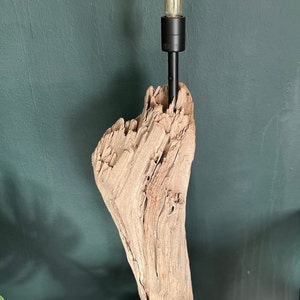 Driftwood table lamp from France with orange lightbulb