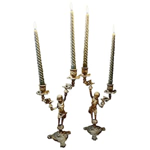 Pair of bronze candelabra decorated with Putti, 19th century / Cherubs