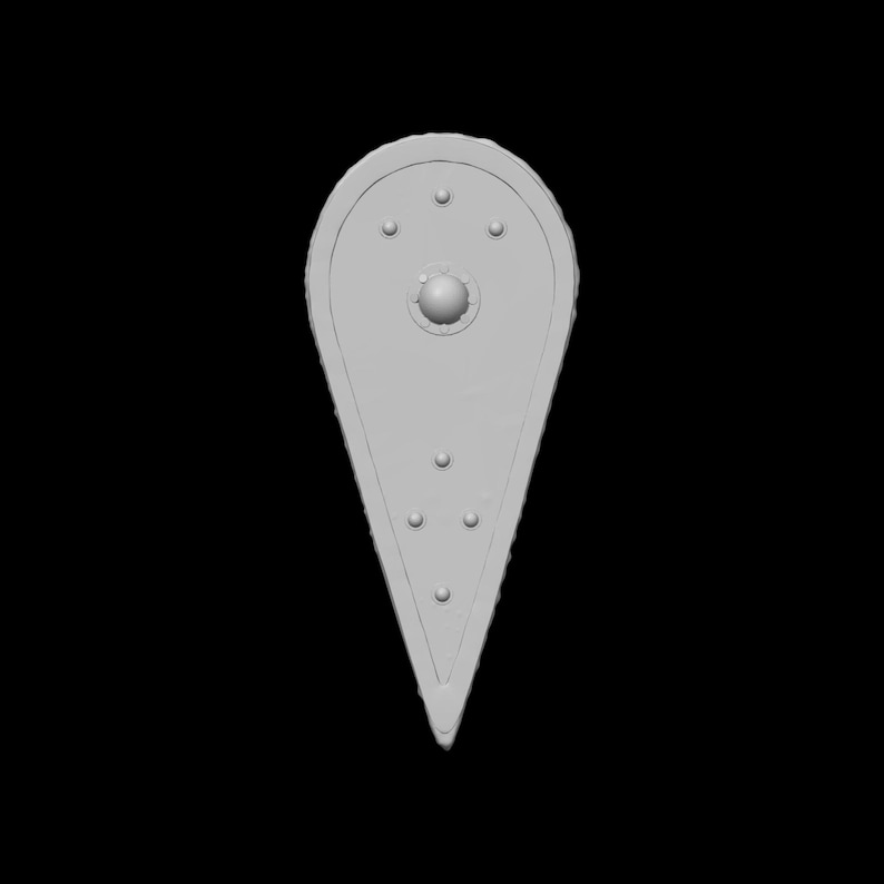 May include: A light gray, teardrop-shaped shield with a rounded top and pointed bottom. The shield features a central, raised sphere and several smaller, circular indentations. The edges have a textured, decorative border. The background is black.