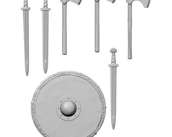 May include: A collection of Viking-themed weaponry, including swords, axes, and a round shield. The swords have detailed hilts and long blades. The axes feature a classic design. The shield has a central boss and a decorative border.
