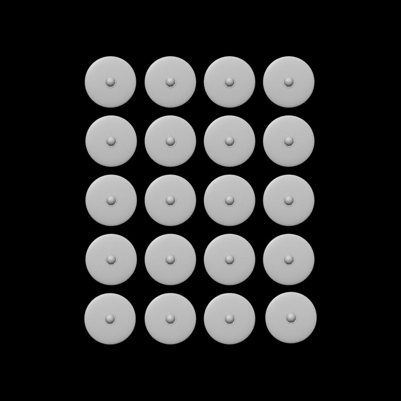May include: A grid of twenty-four small, round, light gray objects with a central, raised dot. The objects are evenly spaced against a black background, creating a pattern. The objects appear to be made of a smooth, matte material.