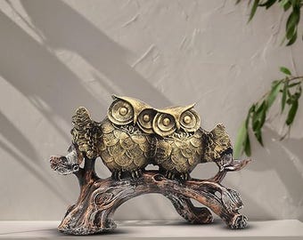 Figura decorativa de búho, dos búhos en una rama, acabado en bronce antiguo.
