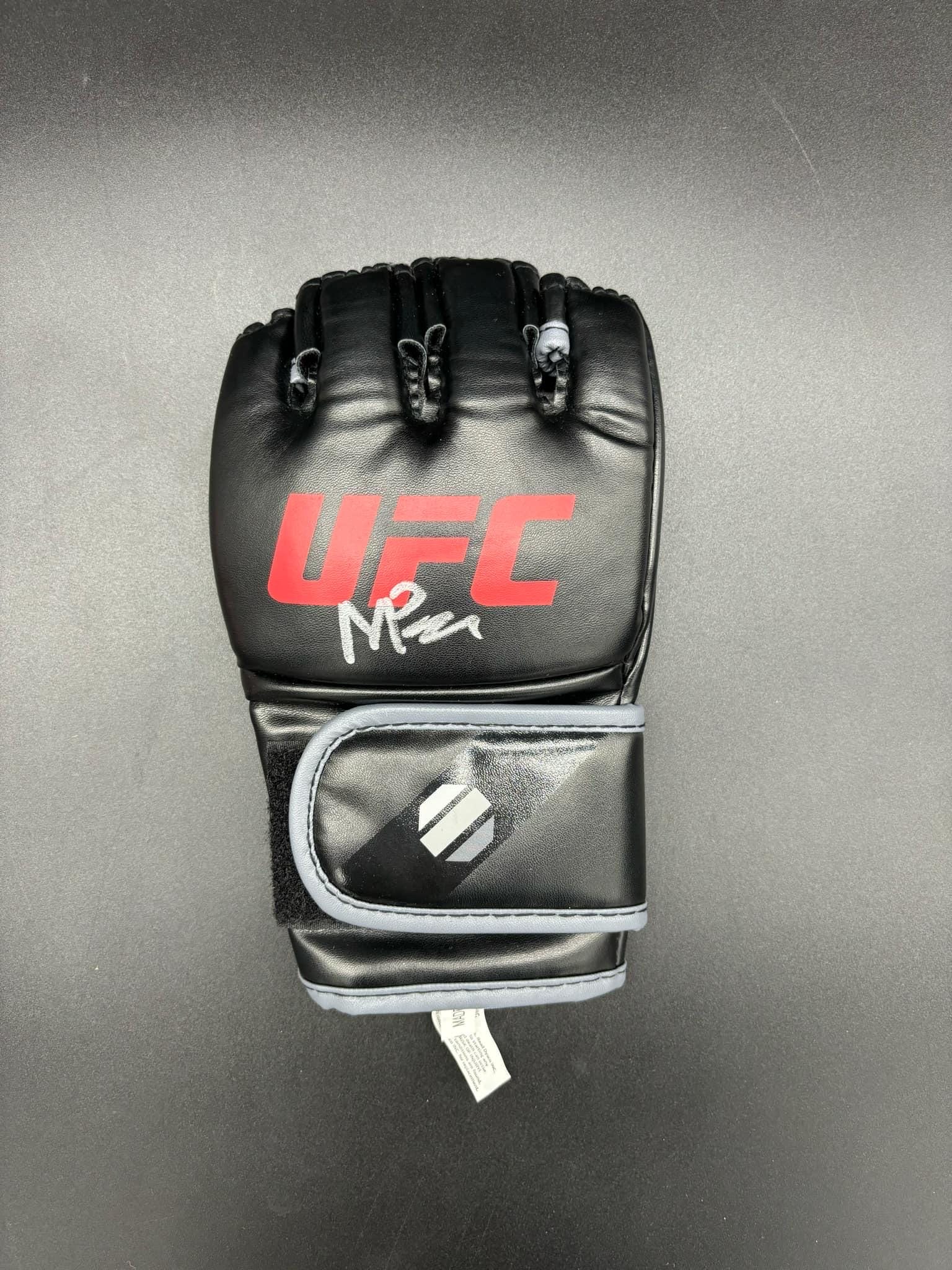 Signed UFC glove by Mick Parking