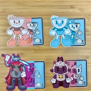 May include: Four sticker designs featuring cartoon characters with a split-screen effect. The first two stickers feature a blue and red cuphead character with a straw and a surprised expression. The third sticker features a red and blue character with a sword and a cape. The fourth sticker features a purple and red character with a sheep head and a surprised expression.